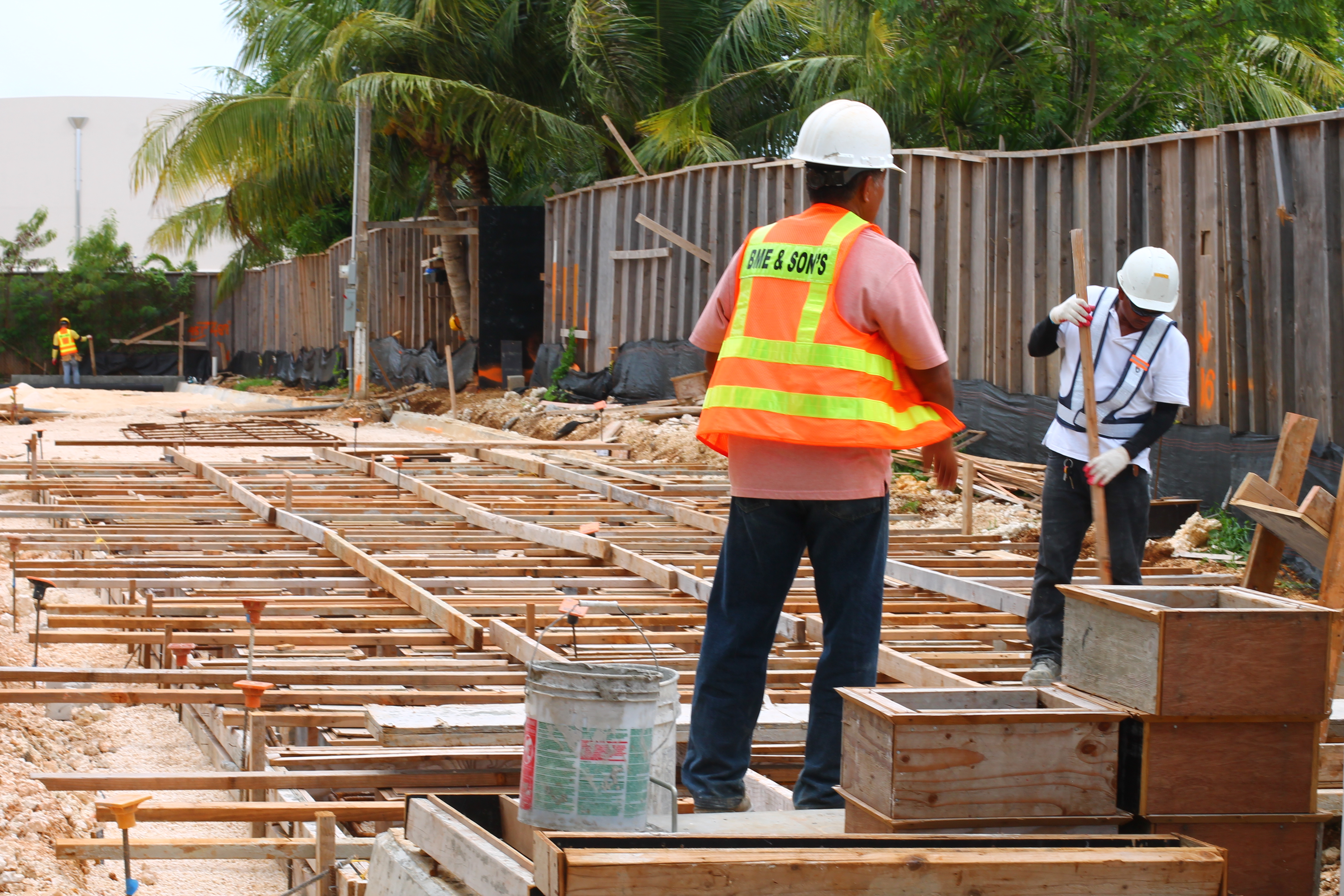 Men standing on wood